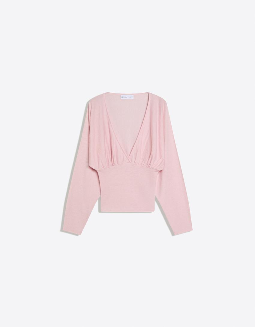 Blusa com decote em V e faixa